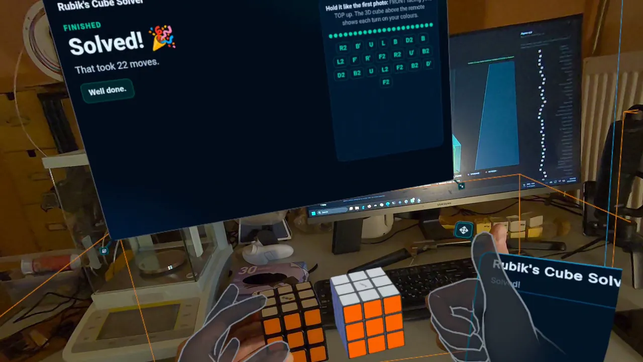 Headset view: a panel reading “Solved! That took 22 moves” above the solved real cube and the 3D cube